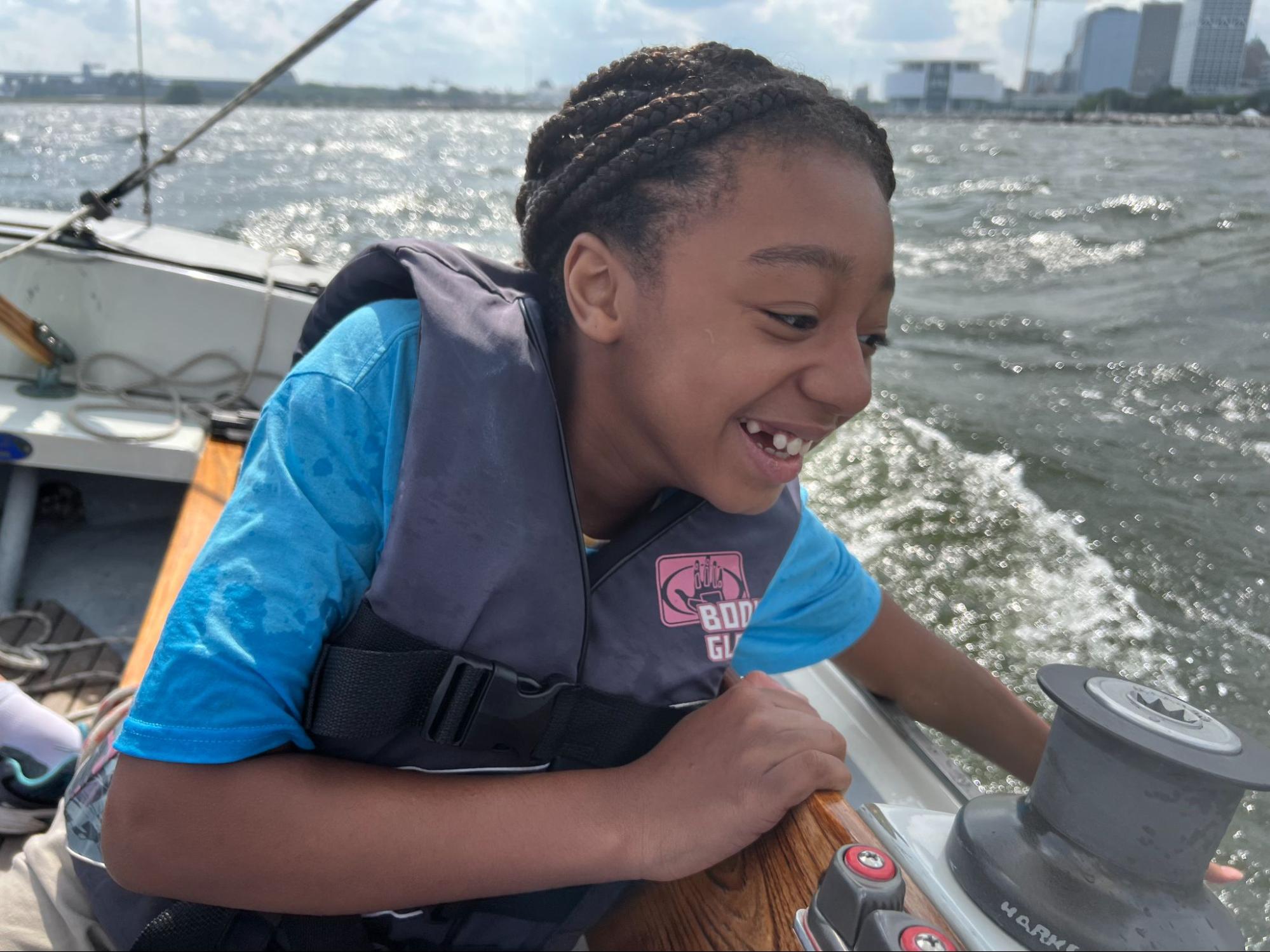 Girl enjoying a ride in an ensign